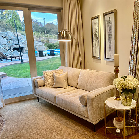 interior of a house with a white couch and gold decor